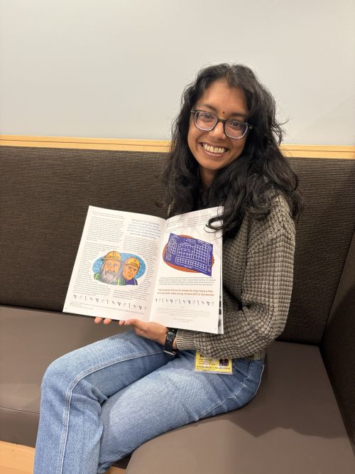 Charu displays Colter's illustrated story in EquilibriUM Magazine.